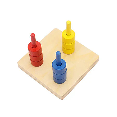 Montessori Colour Discs On Three Vertical Dowels
