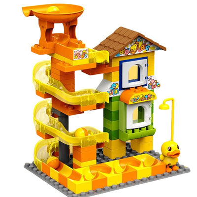 Juego de pistas de canicas con pato amarillo