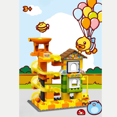 Juego de pistas de canicas con pato amarillo