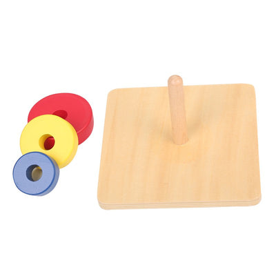 Three Discs On A Vertical Dowel